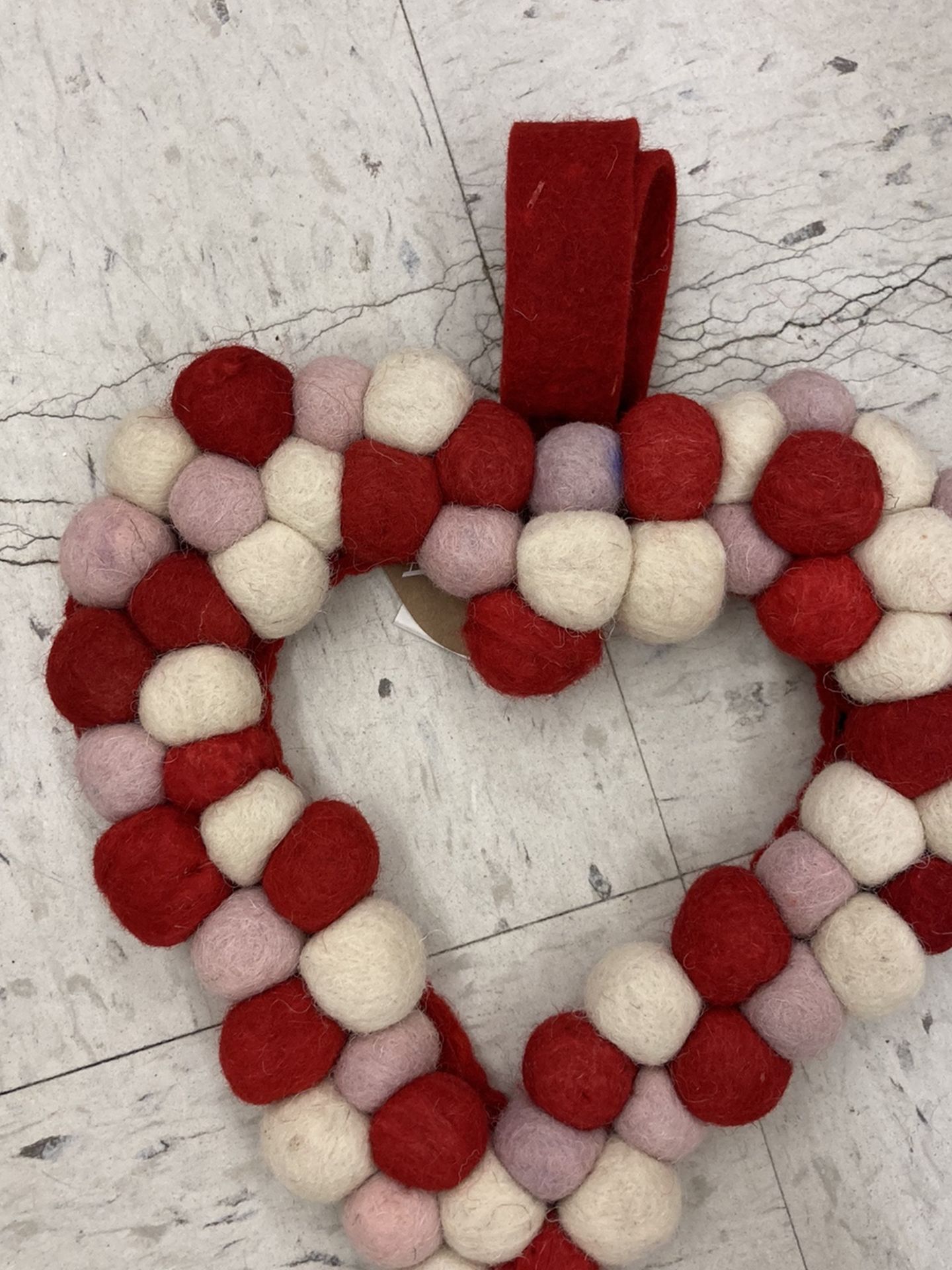 Yarn pompom heart wreath