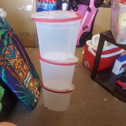 Set up 3 Rubbermaid storage containers