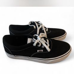 Black and white Vans low top
