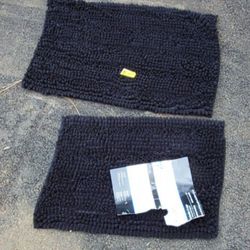 2 black BATH RUGS