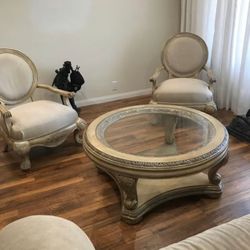 wooden coffee table and 2 armchairs