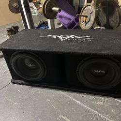 Dual 12 inch Skar audio subs 