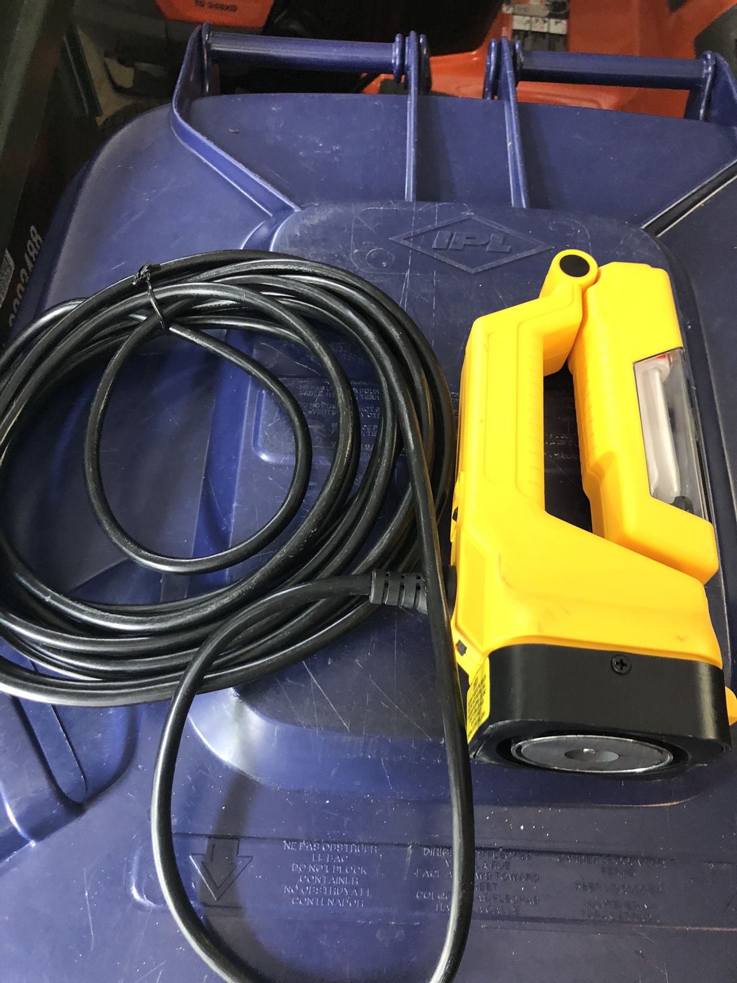 Portable light with magnetic base in excellent condition