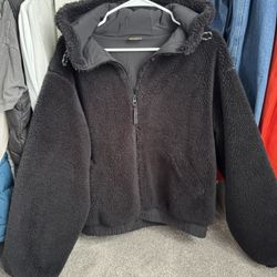 Zella women's faux fur zip-up jacket with a hood.