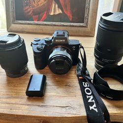 Sony a7 III mirrorless full-frame camera with three lenses