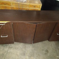 Cabinet base with 4 filing drawers and middle shelve behind doors