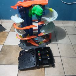 Hot wheels ultimate garage with cars and case