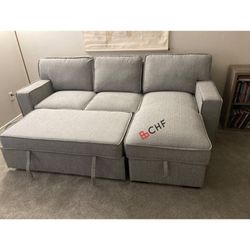 Living room sectional sofa with storage chaise and pull out bed 