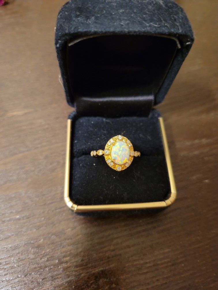 Beautiful costume opal ring.  I have never worn.  Size 5 1/2.