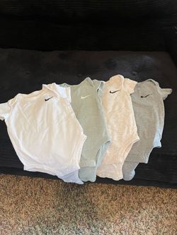 (4) Baby Nike onesie