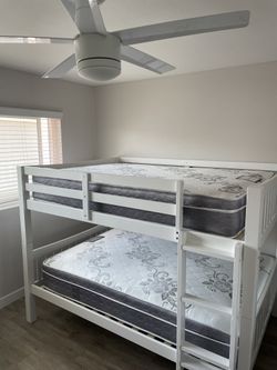 Full over Full bunk bed. Dark walnut,grey & white-$499. Full mattresses -$125.00 each. Assembly not included. Taxes included. Free delivery.  Se habla