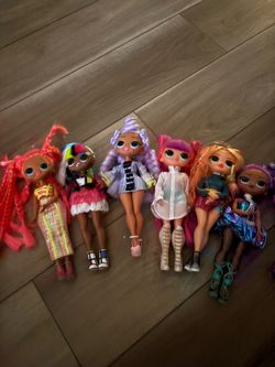 collection of L.O.L. Surprise! O.M.G. fashion dolls, known for their distinct styles and accessories