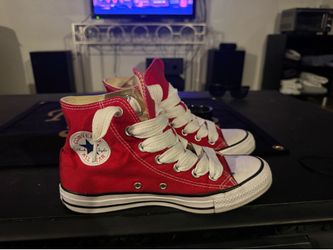 Red Converse Chuck Taylor All Star high-top sneakers with white laces