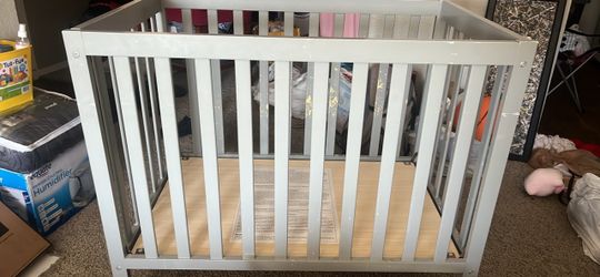 like new solid wooden gray crib