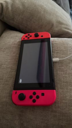 Nintendo Switch with Red Joy-Cons – Good Condition