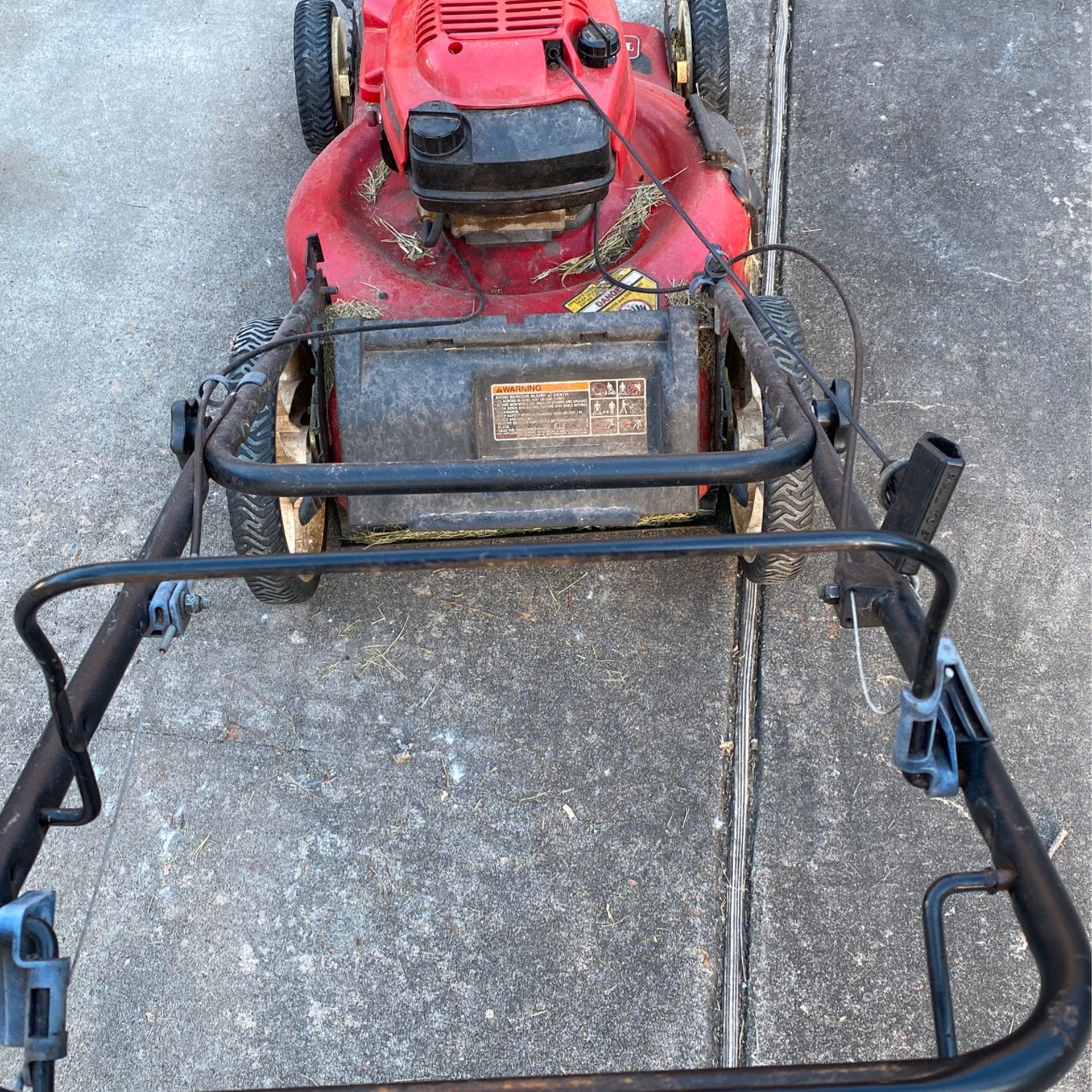 Two Running Lawn Mowers