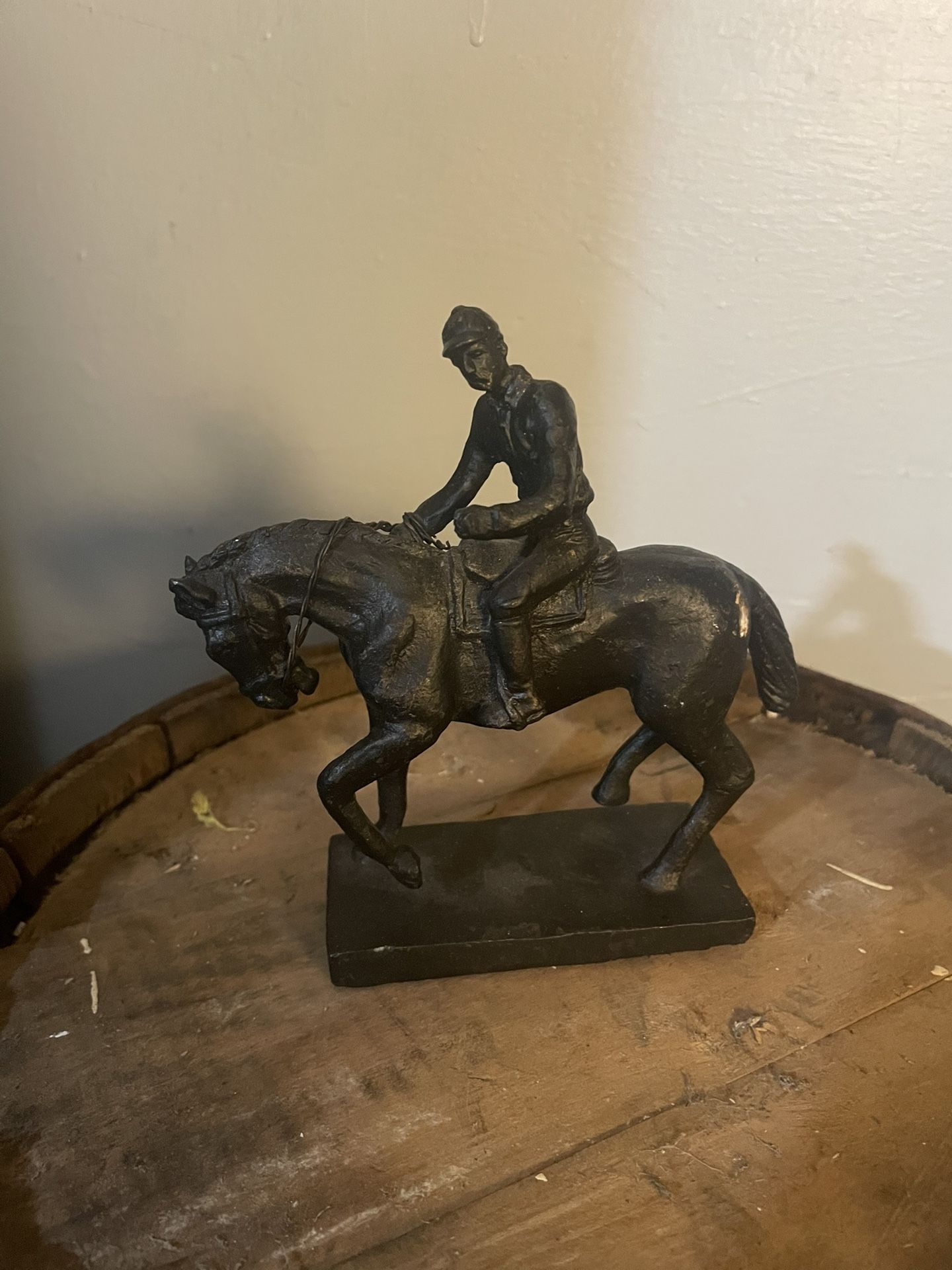 Cast bronze jockey on horse statue