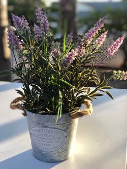 LAVENDER FLORAL ARRANGEMENT w container
