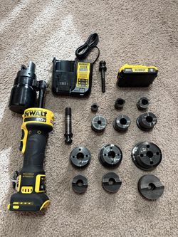 Dewalt 20V Lithium-Ion Cordless 1/2 in. - 2 in. Knock-Out Tool Kit with 2 Ah Battery and charger   The 1-inch cutter is broken; the rest of the kit is