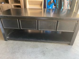 Coffee table with rising top