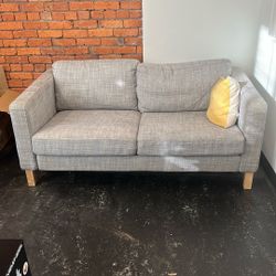 Grey Loveseat With Pillow