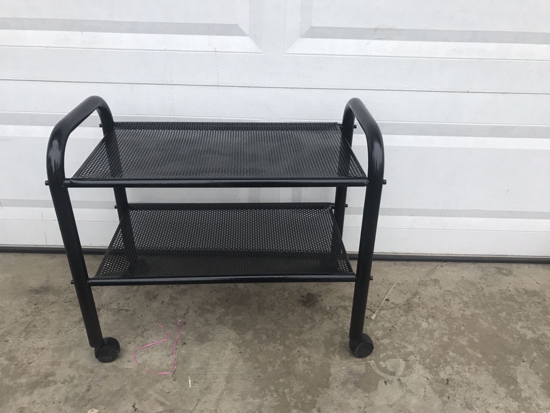 Metal rolling shelves. Great for Garage cuz you can move it around or closets.