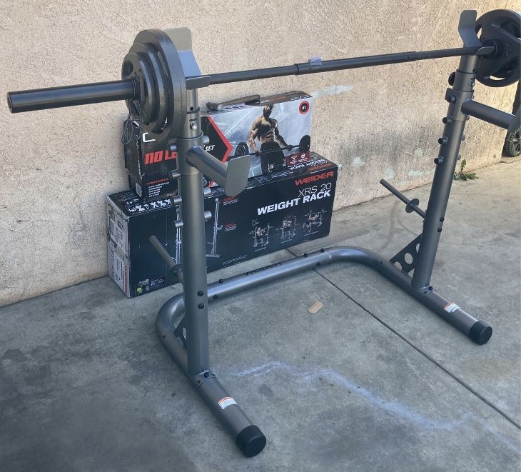 Weights XRS 20 Squat Rack With 110lb Olympic Set Comes With a 3 Piece 7ft Olympic Bar 2x25s,2x10s and 2x5s (built or in Box)