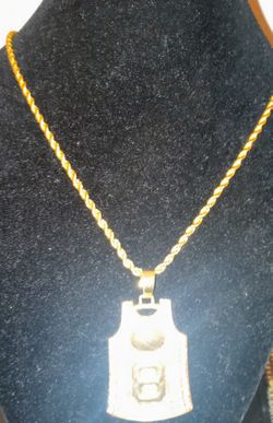 Blinged Out Iced Gold and Silver Iced Kobe and. Jordan jersey. Charm and chain