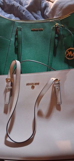 Two Michael Kors totes, both brand new with tags, never used. Selling as a bundle or separately — buyer's choice.
Michael Kors "Jet Set Charm" MD TZ T