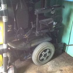"Quantum 600" full tilt, electric wheel chair with charger.