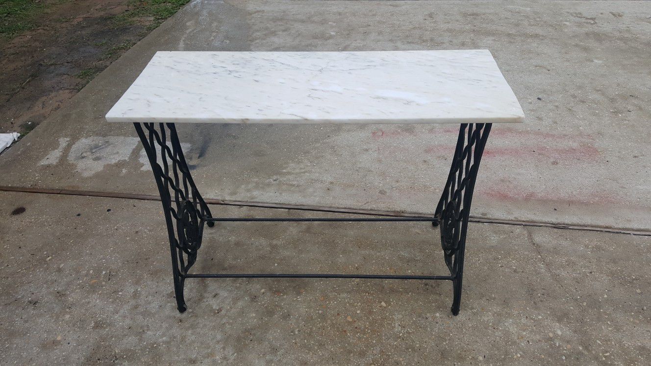 Old singer sewing machine stand with granite top
