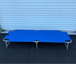 Blue Outdoor folding camping cot sturdy steel frame.  Capacity: Supports a maximum weight of 264 lbs. Dimensions: Measures 74inches long and 23inches 
