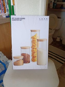 Four piece glass round canister set