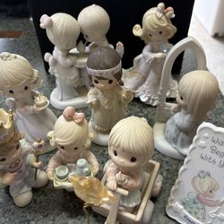 Precious Moments statues and picture frame. 