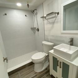 Bathroom Tile With Toilet And Beautiful Vanity 