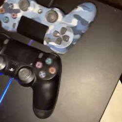 playstation 4 with 2 remotes cords and games 