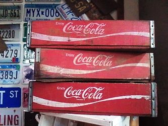 Coca-Cola crates one wooden and two plastic