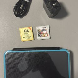 Nintendo 2DS XL Bundle + Charger + Super Smash Bros (3DS) + 64GB microSD