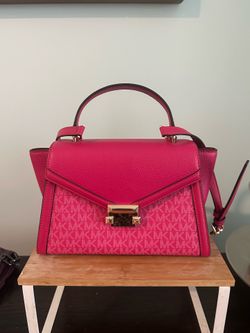 Pink Michael Kors bag with shoulder strap