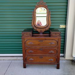Early 1900's Victorian Revival Walnut Dresser with Oval Mirror