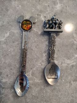 Two Disney Spoons little marks on the back