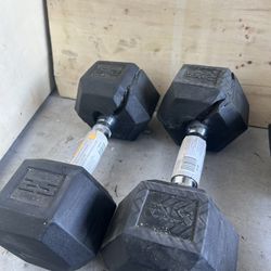 Pair of 25lb rubber dumbbells with rubber lifted