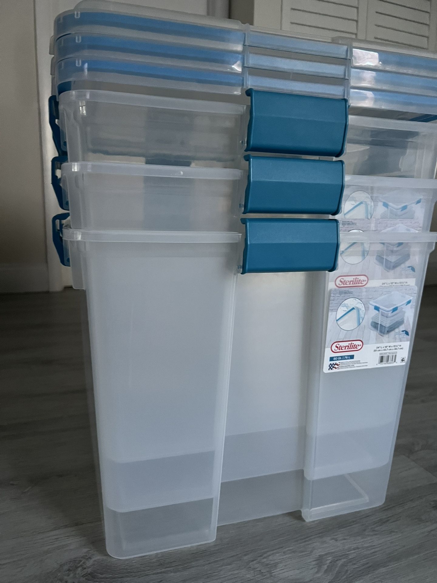 Selling 3 Sterilite 80-quart clear plastic storage bins with blue gasket-sealed lids. These are used but in good condition. All bins have lids that la