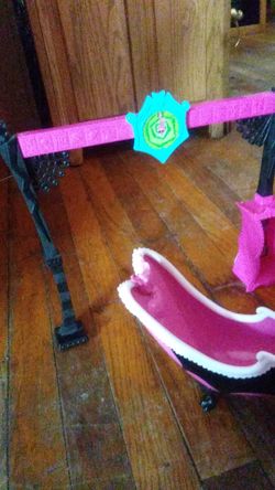 Monster high accesories a bath tub a mirror dresser a stand up mirror and a shelf and a car lot