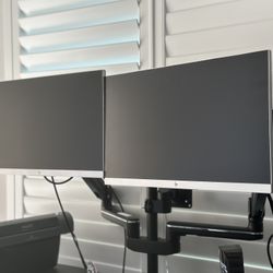 Dual HP monitors with heavy duty adjustable desk mount 