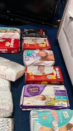 VARIOUS PACKS OF NEWBORN DIAPERS..READ DESCRIPT