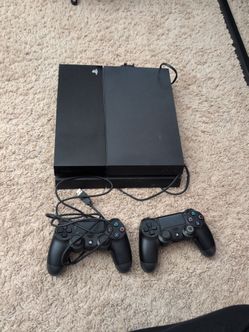 Sony PlayStation 4 Console with Two Controllers