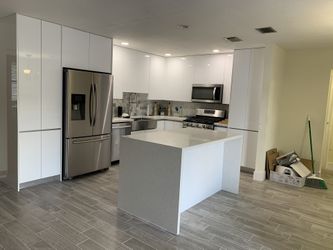 Kichen Cabinets/ Countertops/ Laminate Flooring And Closets 