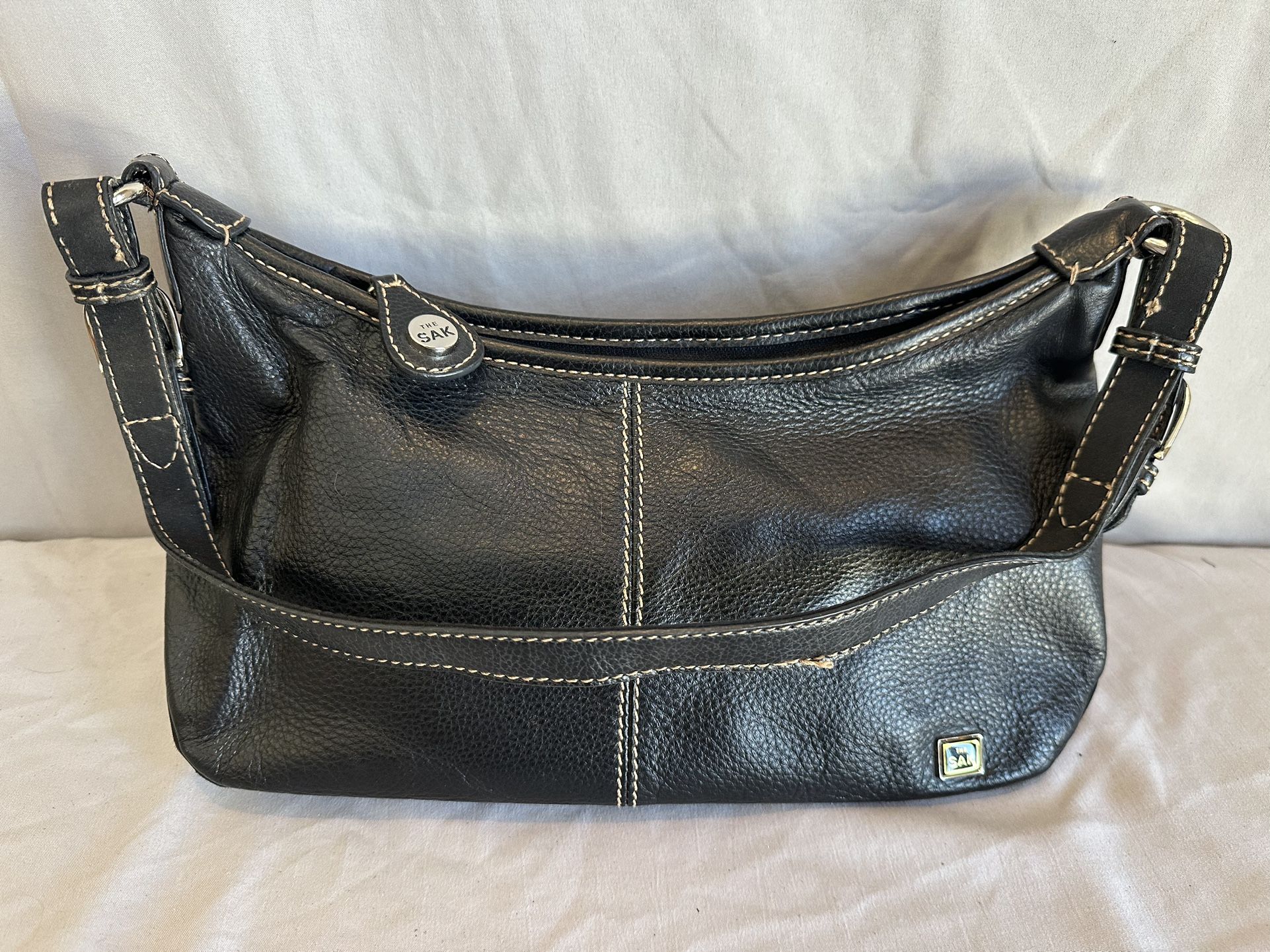 The SAK black leather shoulder bag / purse