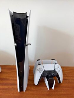 PlayStation 5 Digital Edition Console (Slim) with two controllers and charging station
